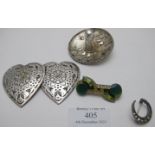 An assortment of items to include a heart shaped white metal nurses buckle, a silver crescent shaped