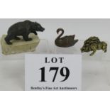 A small well cast bronze figure of a bear signed Siggy Puchta, a bronze swan and a small bronze