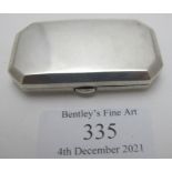 A small rectangular silver compact lacking mirror, Birmingham 1910, Mappin & Webb, approx weight