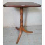 A 19th century tilt top square wine table, the mahogany top raised on a ring turned fruitwood