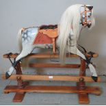 A vintage dappled grey rocking horse by Lines Bros with real horsehair mane and tail and high