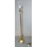 A contemporary brass standard lamp in the Neo-classical taste with a reeded column raised on a