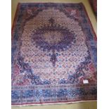 A fine antique Moud carpet with a central body of blue on cream and detailed woven borders. 315cm