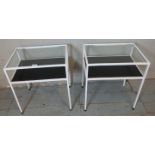 A pair of vintage mid century two tier bedside tables the white painted metal framed housing drop in