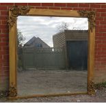 A large 19th century giltwood framed square over mantle mirror, with applied acanthus scrolls&