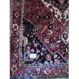 A quality Bakhtiar carpet. A central diamond medallion on a burnt amber field. 3.10 x 2.15. Very