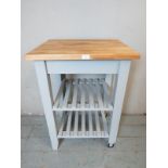 A contemporary butcher's block with beech work surface, raised on a dover grey base with two tier