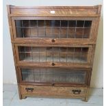 A vintage oak Globe Wernicke style three section stacking bookcase, with leaded glazed doors and one