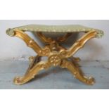 A 19th century Italian pliant 'X' frame stool, the giltwood frame carved with acanthus leaves and