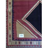 A fine Qashqai Kilim rug. Condition and colour is good. 2.45 x 1.55.