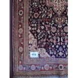 A fine Sarouk rug with central motif depicting flowers in cream blue and red. 2.25 x 1.35. Very good