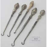 A collection of five silver handled button hooks, all fully hallmarked to include Chester 1897 &