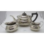 A late Victorian Georgian-revival silver three piece tea set by Mappin Brothers, 66 Cheapside &