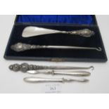 A boxed pair of silver handled button hook & shoe horn, Chester 1906, a silver handled button