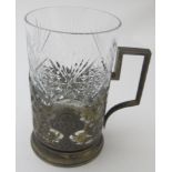 A Russian white metal tea glass holder with handle and with niello decoration, marked 875, approx