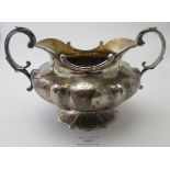 An impressive large two handled Victorian silver sugar bowl with gilded interior. The double