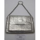 An unusual double compartment card case with ring handle, heavily engraved with foliate design,
