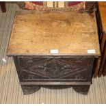 A SMALL OAK BOX COFFER with carved panel frontage