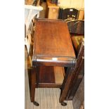 A SECOND QUARTER 20TH CENTURY OAK METAMORPHIC TEA TROLLEY fitted with a cutlery drawer