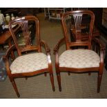 A PAIR OF MODERN ARMCHAIRS with overstuffed seat pads