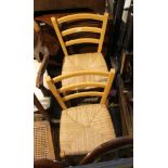 A PAIR OF MODERN LADDER BACK RUSH SEATED CHAIRS