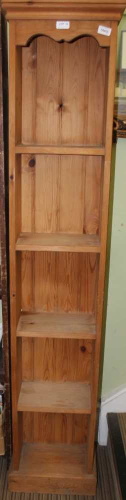 A PINE SIX FOOT TALL NARROW SET OF OPEN SHELVES