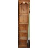 A PINE SIX FOOT TALL NARROW SET OF OPEN SHELVES