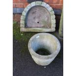 A CAST CONCRETE GARDEN PLANTER & A CAST CONCRETE 'D' SHAPED PLANTER