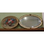 AN OVAL BEVEL PLATE WALL MIRROR in craquelure frame, together with an oval hand painted panel of a