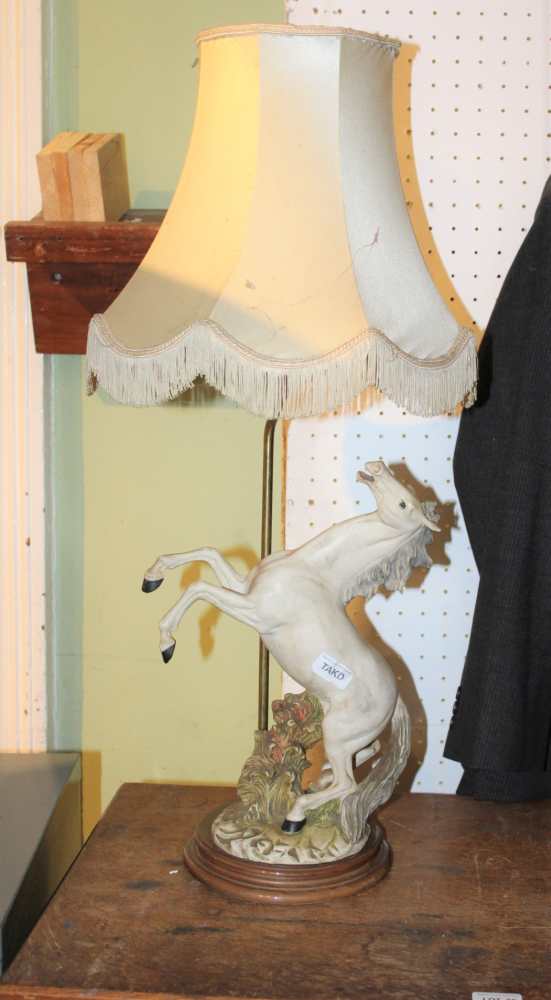 A HAND CARVED BOOMERANG together with a decorative table light in the form of a prancing white horse - Image 3 of 3