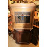 TWO WOODEN HANGING CORNER CUPBOARDS, one 19th century oak, the other probable late 19th century