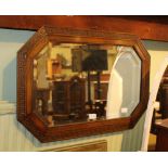 AN OAK FRAMED BEVEL PLATE WALL MIRROR with Greek key detail