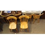 A SET OF SIX BLONDE WOOD SPINDLE BACK SOLID SEATED KITCHEN CHAIRS