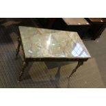 A CAST METAL FRAMED RECTANGULAR ONYX TOPPED COFFEE TABLE