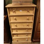 A STRIPPED PINE TALL CHEST OF SIX DRAWERS