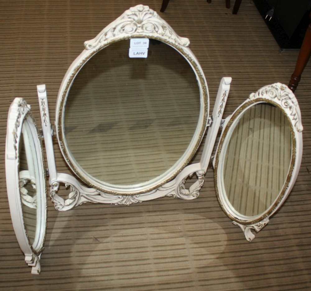 AN OVAL PLAIN PLATE DRESSING TABLE TRIPLE MIRROR