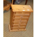 A SMALL MODERN PINE SIX DRAWER COLLECTOR'S CHEST