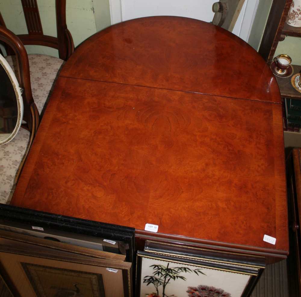 A REPRODUCTION POLLARD YEW WOOD COLOURED OVAL TWIN FLAP TOPPED TABLE