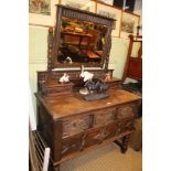 A WELL MADE REPRODUCTION OAK FINISHED DRESSING TABLE with adjustable mirrored back and twin