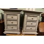 A PAIR OF DISTRESSED PAINT EFFECT THREE DRAWER BEDSIDE UNITS