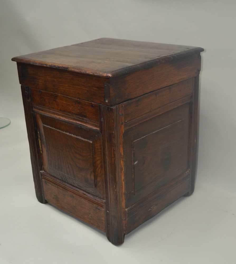 AN OAK HINGED LIDDED BOX, assembled from early 18th century panels, 41cm x 39cm x 48cm high