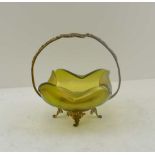 A POSSIBLY LOETZ LUSTRE GLASS FOLDED RIM DISH housed in a gilt metal frame, with intertwined knot