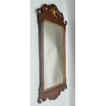 A GEORGIAN DESIGN MAHOGANY FRET FRAME WALL MIRROR with gilded Ho-Ho crest, plate size; 60cm x 34cm