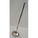 A GEORGE III SILVER PUNCH LADLE, the bowl with beaded rim and pouring lip, fitted a twisted whale