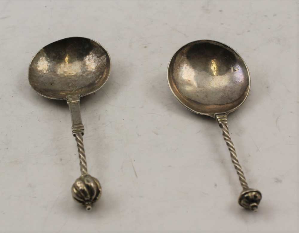 TWO 17TH CENTURY SILVER SPOONS, with large bowls, barley twist stems and knop terminals, some