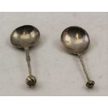 TWO 17TH CENTURY SILVER SPOONS, with large bowls, barley twist stems and knop terminals, some