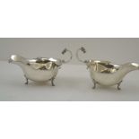 ADIE BROTHERS. LTD A PAIR OF SILVER SAUCE BOATS OF GEORGIAN DESIGN, with cast Celtic form mask