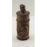 A CARVED TREEN TOBACCO BOX OR NEEDLE CASE, carved with smoking Pasha decoration and mask head