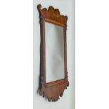 A GEORGIAN DESIGN MAHOGANY FRET FRAME WALL MIRROR, plate size 40cm x 25cm