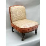 A LATE VICTORIAN UPHOLSTERED NURSING CHAIR raised on turned and fluted fore supports with castors